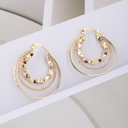 Aretes De Tres Capas Con Aros De Diferentes Tamaños En Cobre
