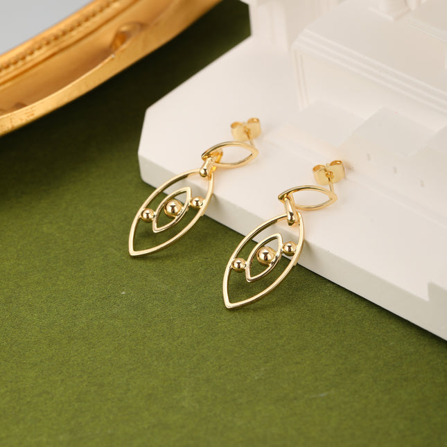 Aretes De Cobre Clásicos Con Colgante Ojo De Demonio En Oro 18K