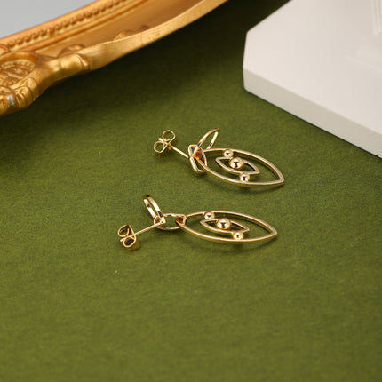 Aretes De Cobre Clásicos Con Colgante Ojo De Demonio En Oro 18K