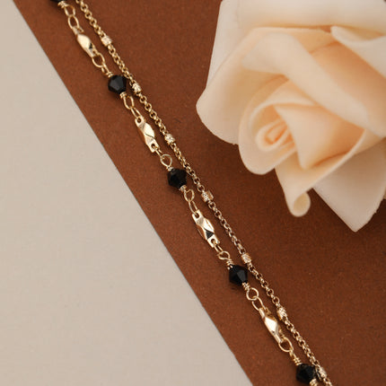 Pulsera De Doble Cadena Con Cristal Negro Y Detalles En Cobre