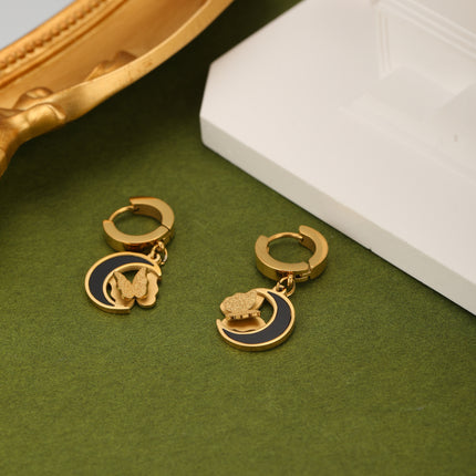 Aretes De Acero Con Colgante De Luna Negra Y Mariposa Flotante