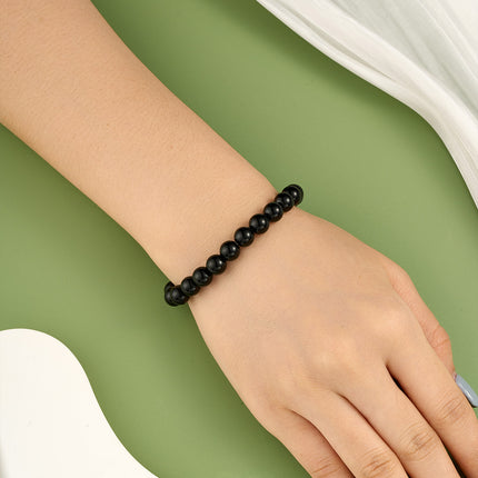Pulsera De Cuentas Negras Suaves Con Diseño Minimalista Y Elegante
