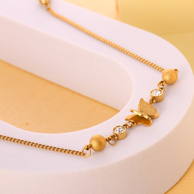 Tobillera Cadena Giratoria De Acero Inoxidable Con Mariposa De Arena Rensada Y Bolas De Acero