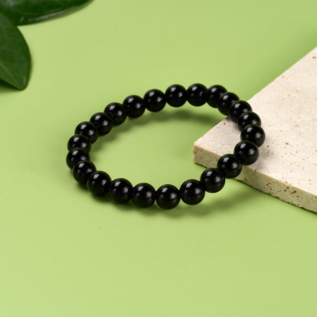 Pulsera De Cuentas Negras Suaves Con Diseño Minimalista Y Elegante