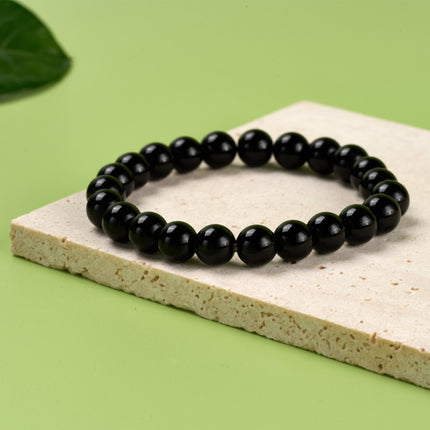 Pulsera De Cuentas Negras Suaves Con Diseño Minimalista Y Elegante