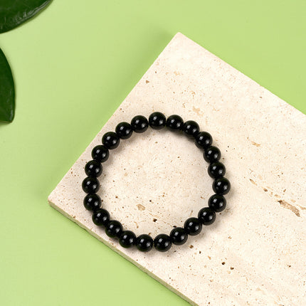 Pulsera De Cuentas Negras Suaves Con Diseño Minimalista Y Elegante