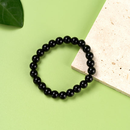 Pulsera De Cuentas Negras Suaves Con Diseño Minimalista Y Elegante