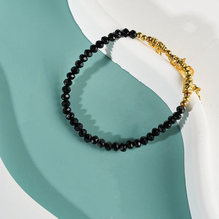 Pulsera De Cuentas Negras Con Tres Colgantes Dorados Estilo Moda