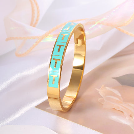 Pulsera Brazalete Con T Dorada En Rectángulo Azul Y Cierre De Clip