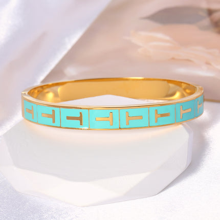 Pulsera Brazalete Con T Dorada En Rectángulo Azul Y Cierre De Clip