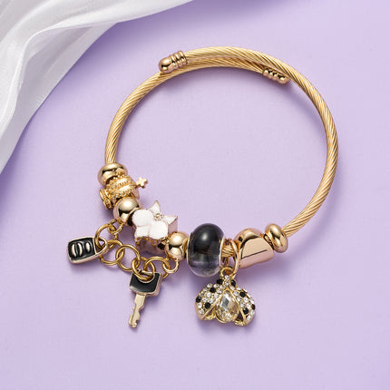 Pulsera De Acero Inoxidable Dorado Con Colgantes De Llave Negra