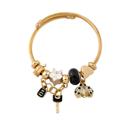 Pulsera De Acero Inoxidable Dorado Con Colgantes De Llave Negra
