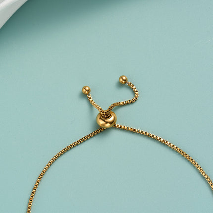Pulsera De Acero Inoxidable Con Delicados Cubos Dorados Estilo Moderno