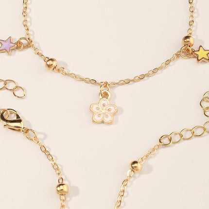 Pulsera Femenina De Metal Con Dijes De Flor O Planeta Y Flecos Modernos