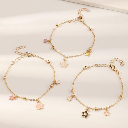 Pulsera Femenina De Metal Con Dijes De Flor O Planeta Y Flecos Modernos