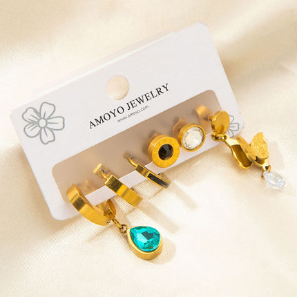 Set De Aretes De Titanio Con Mariposa, Zirconia Azul Y Números Romanos