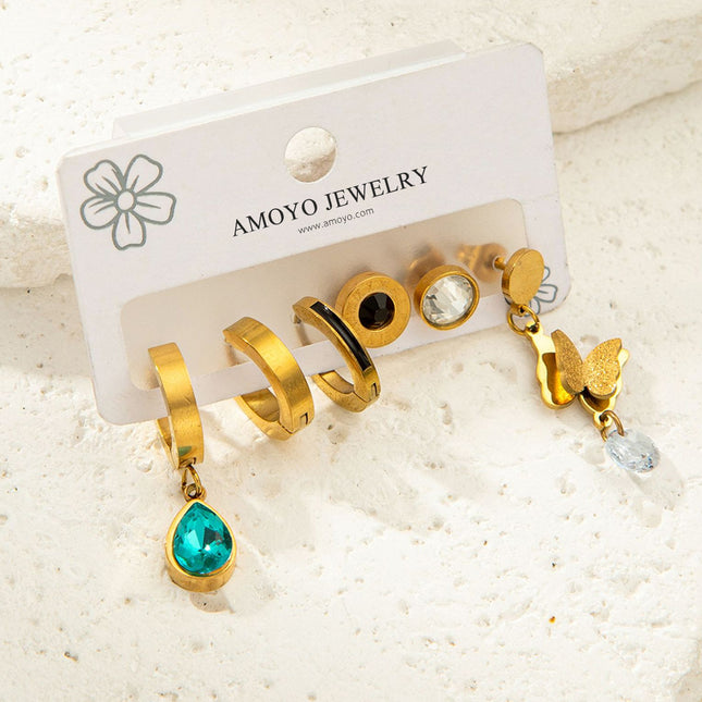 Set De Aretes De Titanio Con Mariposa, Zirconia Azul Y Números Romanos